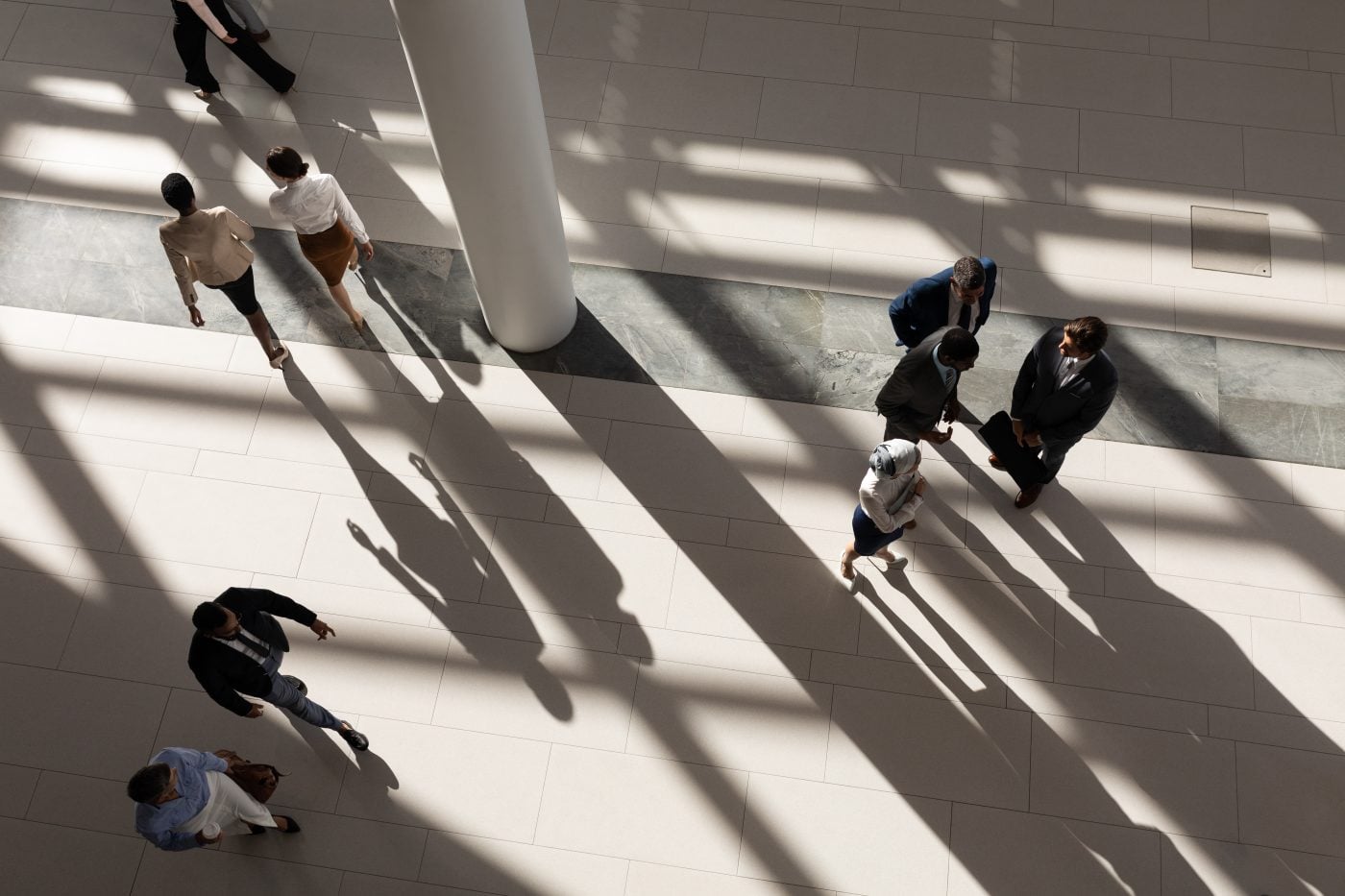 High-angle view of executives meeting around a boardroom table