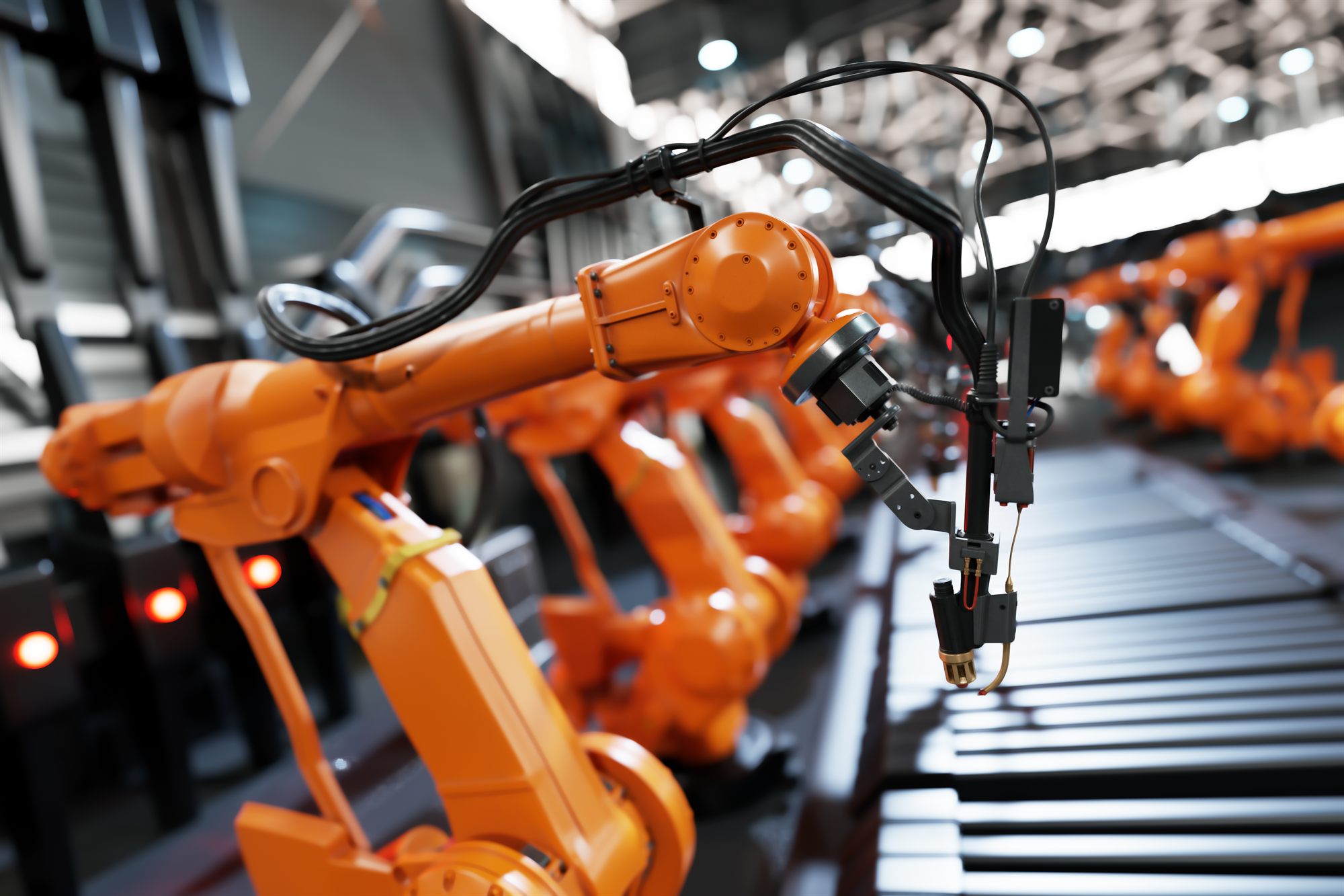 Robotic arms working along an assembly line