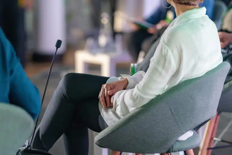 A delegate seated at a business conference