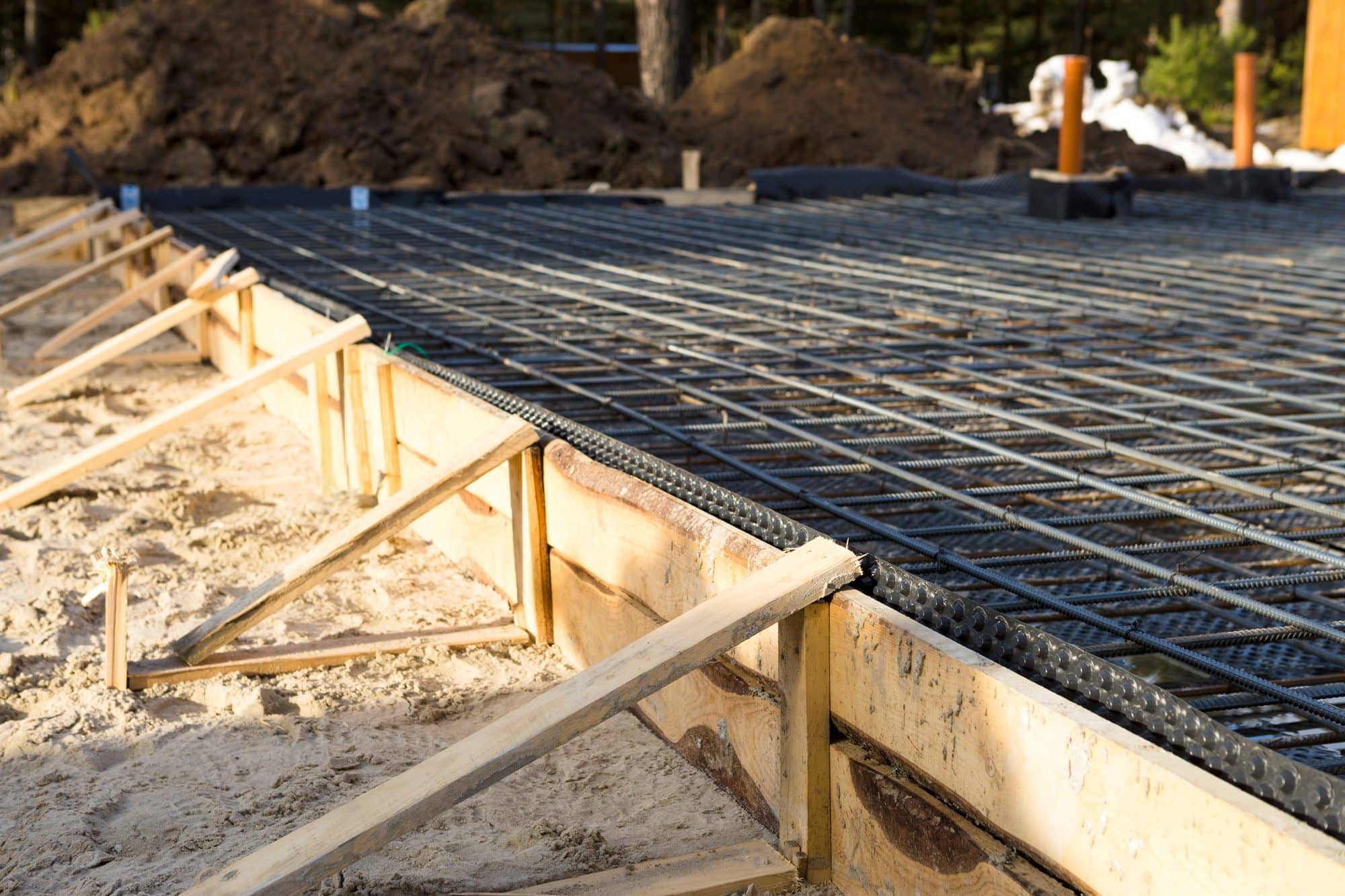 Timber and rebar foundations at the start of a build