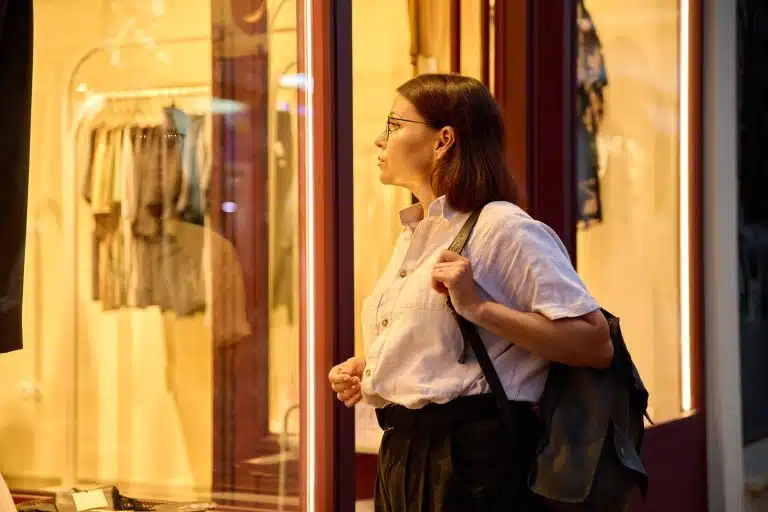 A woman looking into a shop window